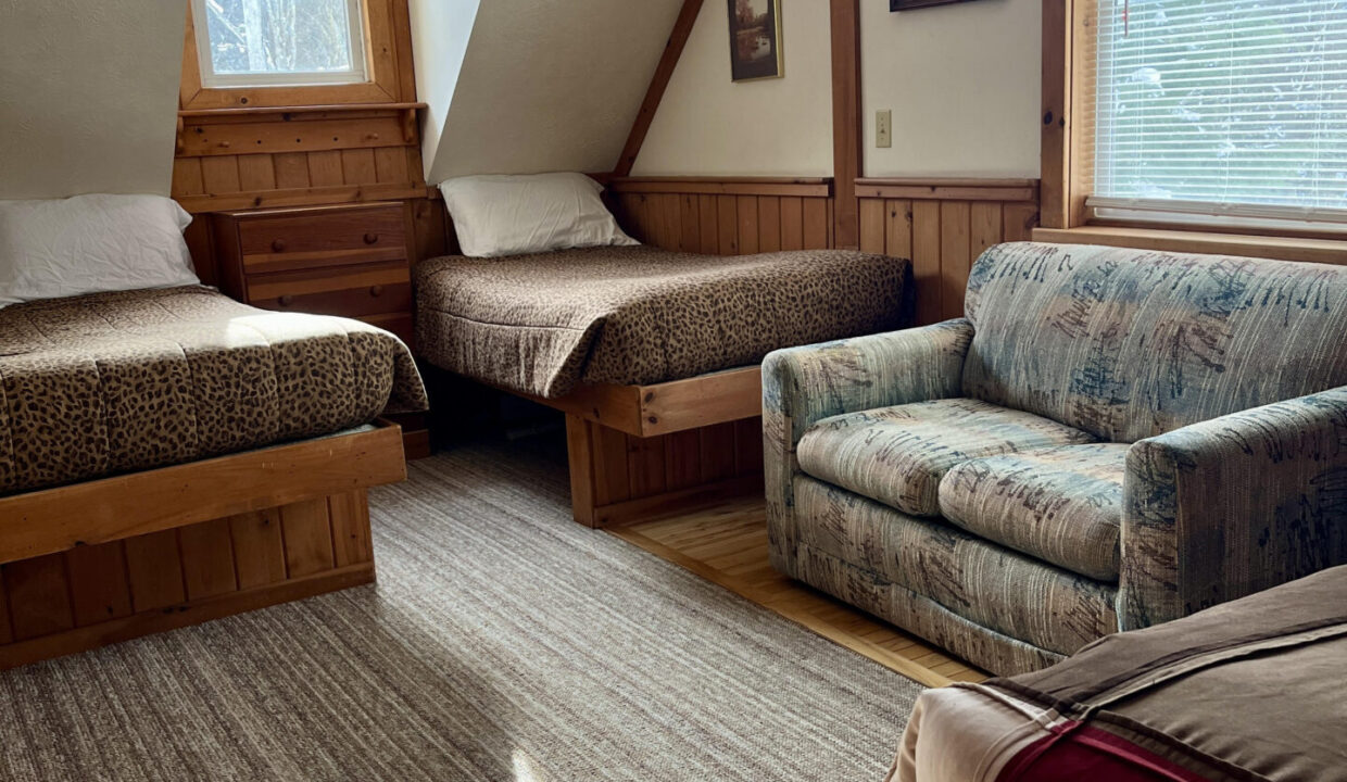 room with twin beds in Stone Mountain Chalets in Ellicottville NY