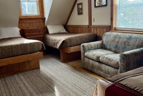 room with twin beds in Stone Mountain Chalets in Ellicottville NY